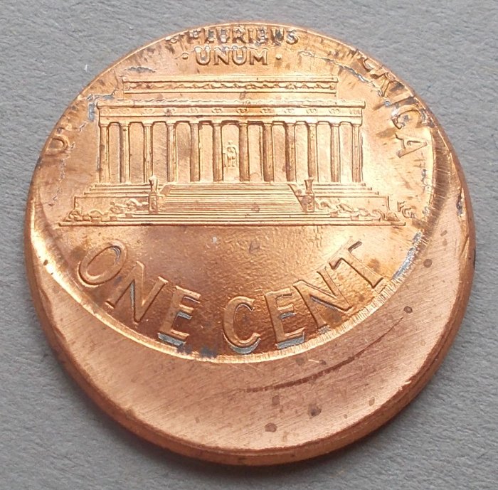 1999-Cent,-Off-Center-Strike